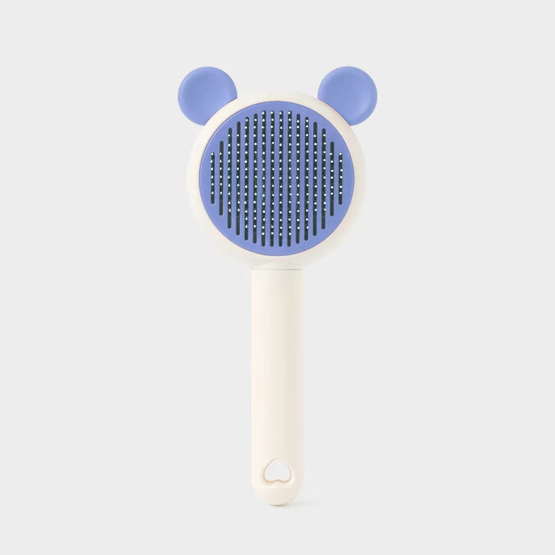 Blue bear-style self-cleaning pet grooming brush variant.