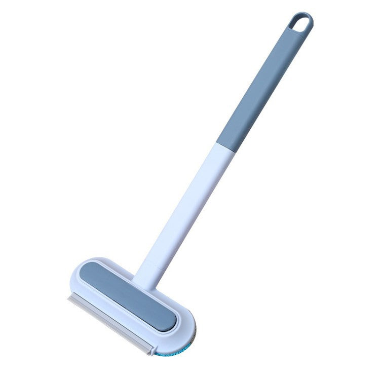 Long-handle blue and gray pet hair removal brush on a white background.