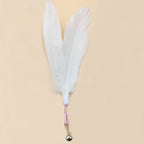 Large white fluffy feather head variant with bell attachment.