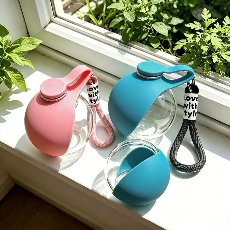 Blue and pink portable pet water containers with the blue silicone bowl component shown separately.