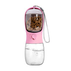 Pink pet water and food bottle with food container nested in the drinking trough, clear water reservoir and wrist strap.