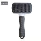 Gray thin-needle rectangular self-cleaning pet grooming brush.