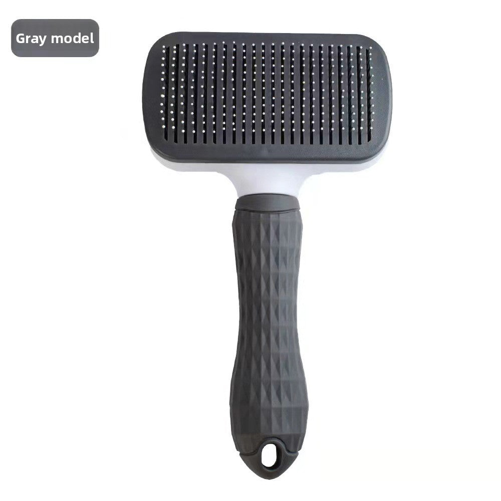 Gray thin-needle rectangular self-cleaning pet grooming brush.