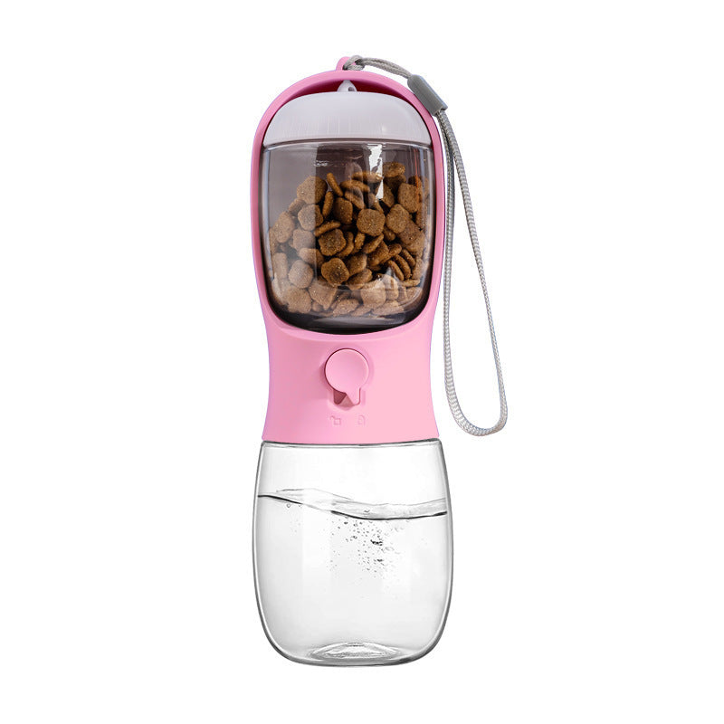 Pink pet water and food bottle with food container nested in the drinking trough, clear water reservoir and wrist strap.