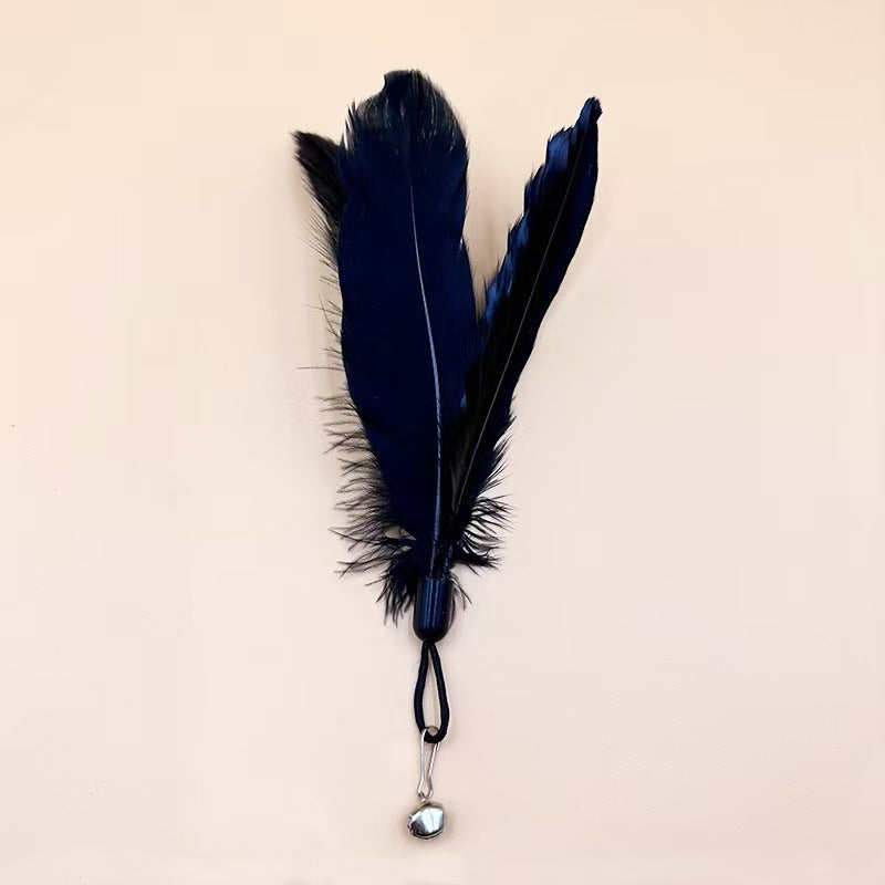 Large black fluffy feather head variant with bell attachment.