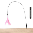 Handheld cat teaser rod variant with pink feather.