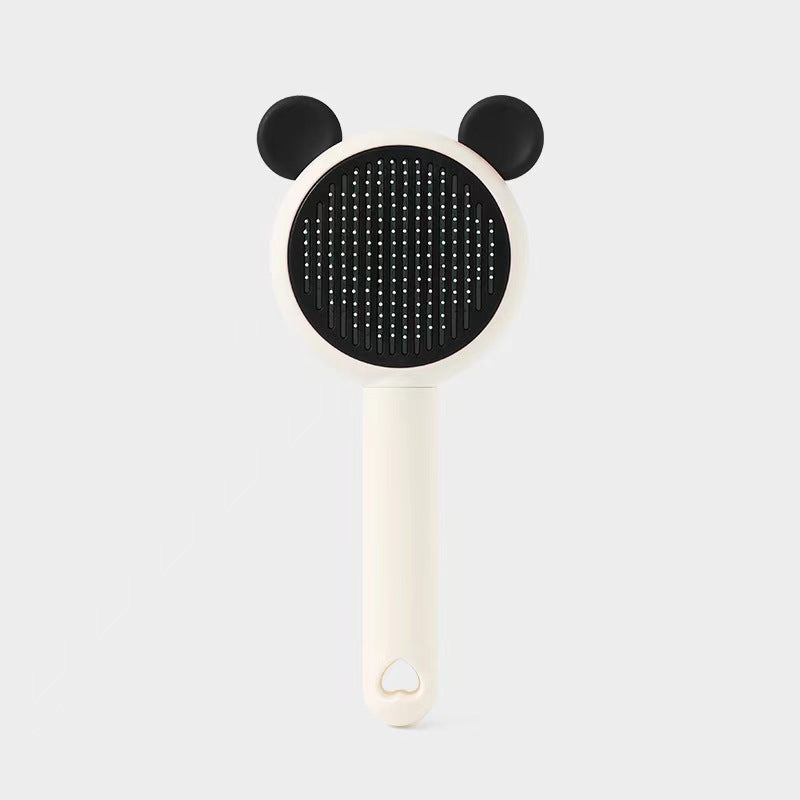 Black bear-style self-cleaning pet grooming brush variant.