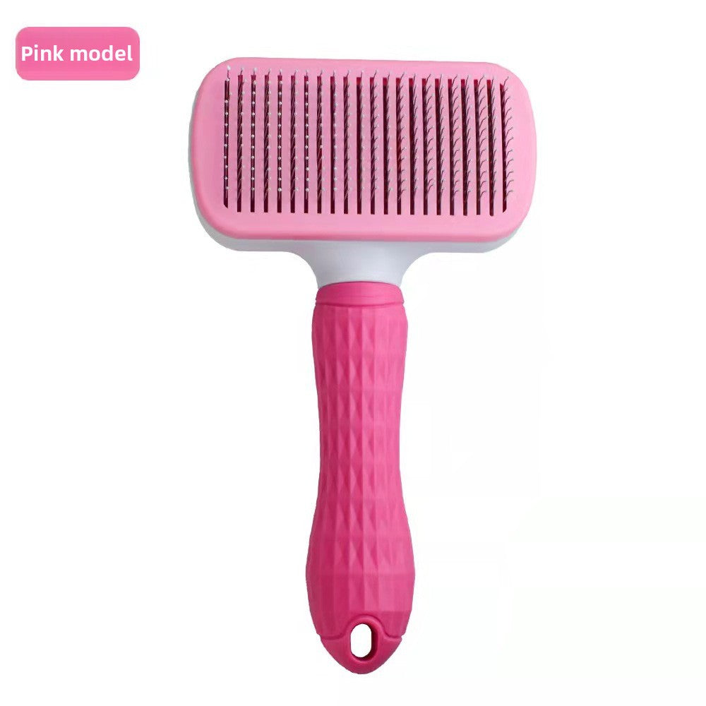 Pink fine-needle rectangular self-cleaning pet grooming brush.