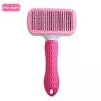 Pink fine-needle rectangular self-cleaning pet grooming brush.