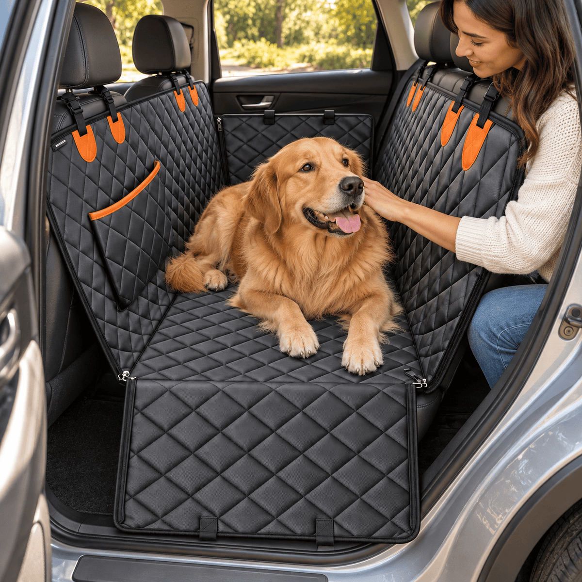 Woman petting a golden retriever on the Oxford car seat mat