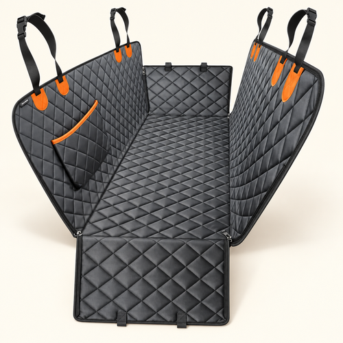 Black diamond-quilted dog car seat hammock mat with orange attachment accents on a warm ivory background.