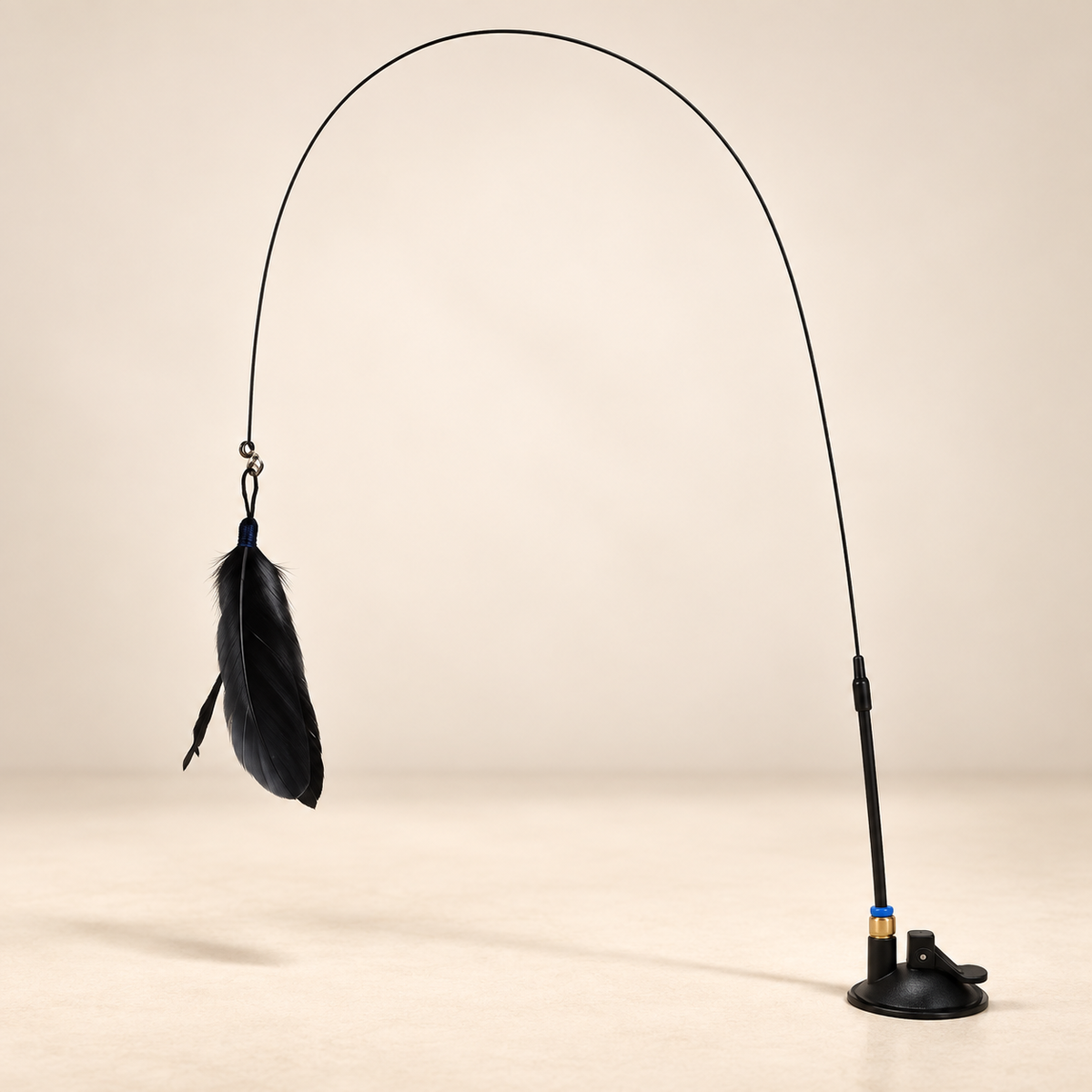 Black-feather cat teaser toy with flexible rod and suction-cup base.